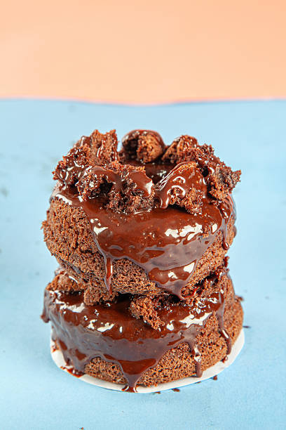 istock Chocolate cake brioche doughnuts gourmet hand made stacked. 2244874261