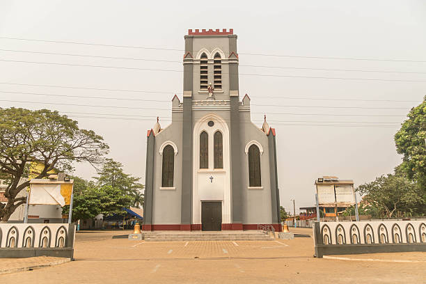 istock Historic Basilica of the Immaculate Conception with large tree on paved square in Ouidah, Benin, West Africa 2244876169