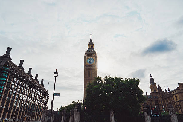Big Ben, Westminster Bridge, London, July 2009.\n\nTaken from underneath the tower clock, Big Ben.  An extreme vertical close up capturing the gold and green rich coloring of the structure and a rare close up  view of the intricate design of the tower.