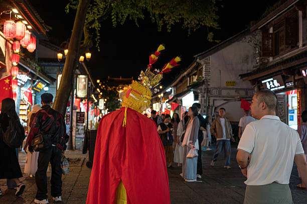 Hubei, China – 02.09.2024: Women dressed in red go door to door singing and performing the Yangko boat dance for donations during the Chinese Spring Festival