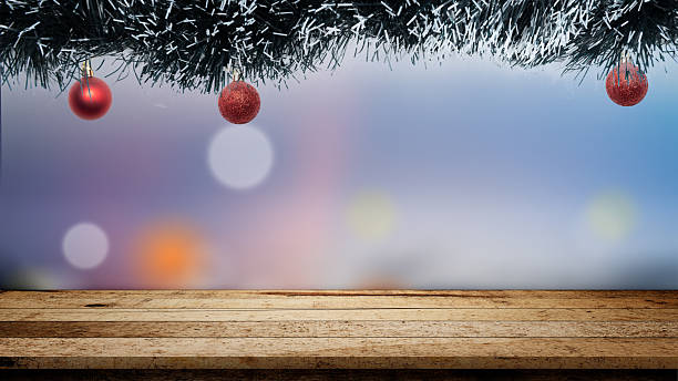 istock Christmas ornaments hanging above the table with a blurred bokeh light background. Copy space. Holiday greetings or winter themes. Concept of the Merry Christmas celebration 2244879266