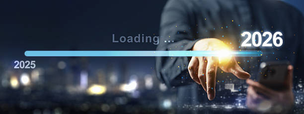 istock Business hand with a cellphone slides the loading bar from 2025 to 2026 on a virtual screen. Happy New Year concept or Celebration 2244880990