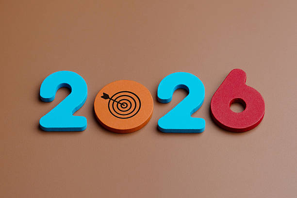istock Colored wooden numbers and a target symbol form 2026. 2244882600