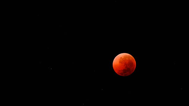 istock A Blood Moon occurs during a total lunar eclipse when the Earth blocks direct sunlight from reaching the moon. 2244886228