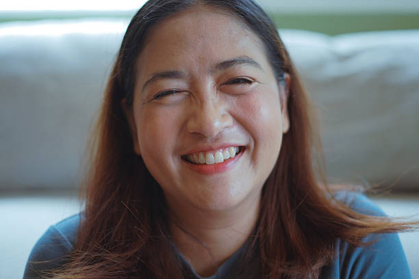 istock Close-up woman's face smiles brightly. 2244890364