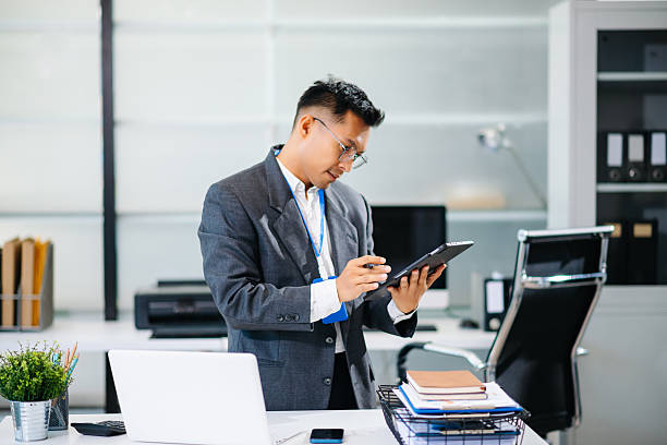 istock Mature business man executive manager looking at laptop watching online webinar training or having virtual meeting video conference doing market research 2244896231
