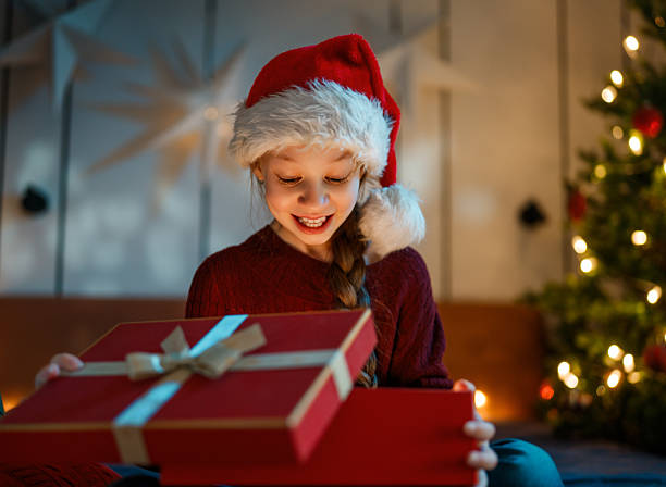 istock girl with Christmas gift 2244899915