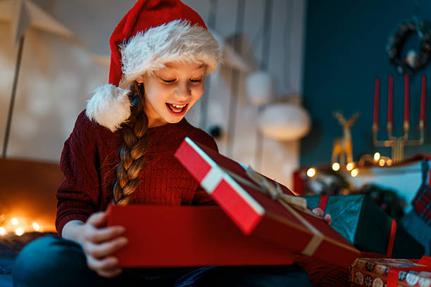 istock girl with Christmas gift 2244899931
