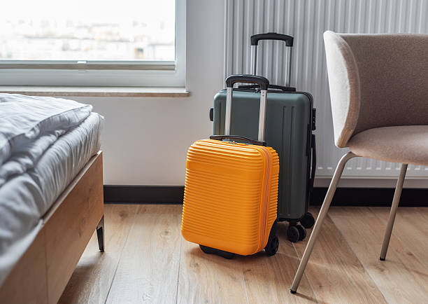istock Suitcases standing in modern hotel room ready for travel 2244900908