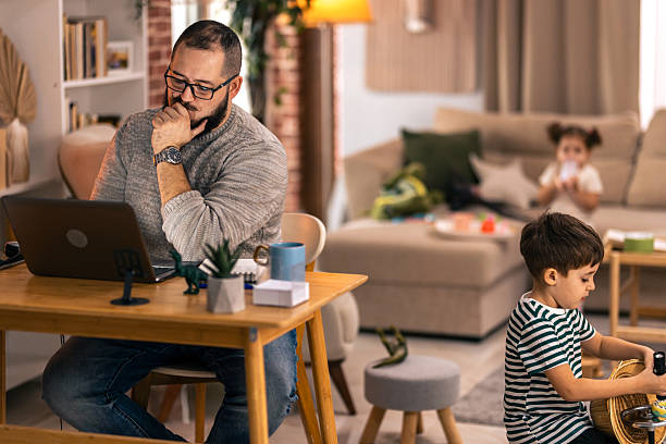 istock Father balancing remote work and parenting responsibilities at home. remote work 2244900967