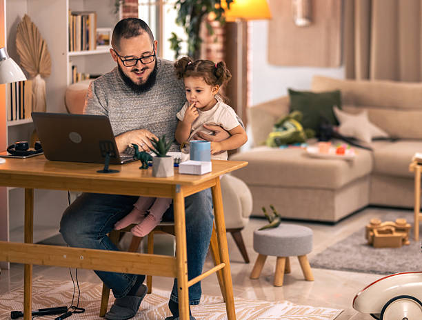 istock Father balancing remote work and parenting responsibilities at home. remote work 2244900982