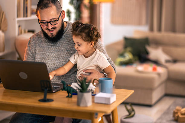 istock Father balancing remote work and parenting responsibilities at home. remote work 2244900986