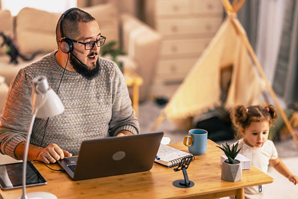 istock Father balancing remote work and parenting responsibilities at home. remote work 2244901079