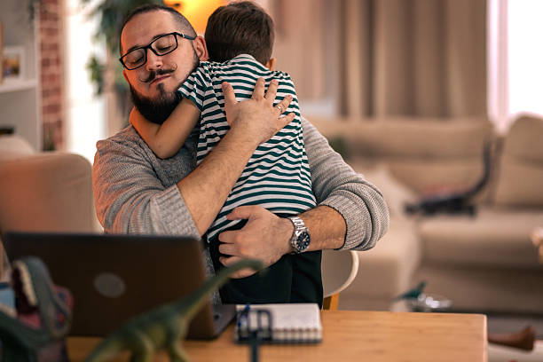 istock Father balancing remote work and parenting responsibilities at home. remote work 2244901688