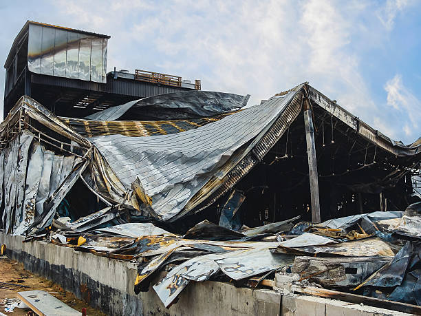 istock A building with extensive fire damage and a collapsed roof, showing the devastating aftermath. 2244903401