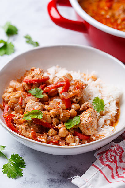 istock Tikka masala with chicken, chickpeas and rice in bowl. 2244905533