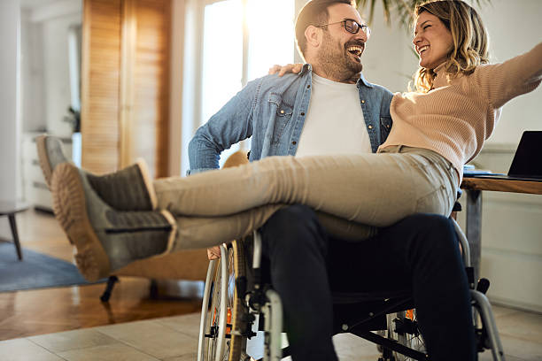 istock Happy disabled man enjoying with his girlfriend at home. 2244907032
