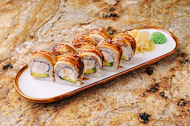 istock Delicious sushi rolls served on a plate in a restaurant setting 2244908216