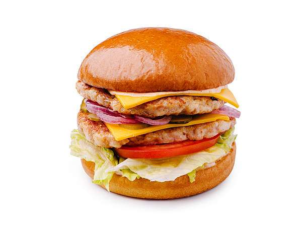 istock Delicious burger stacked high with cheese, lettuce, and fresh vegetables 2244908329