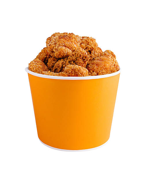 istock Crispy golden fried chicken in an orange container on a white background 2244908483