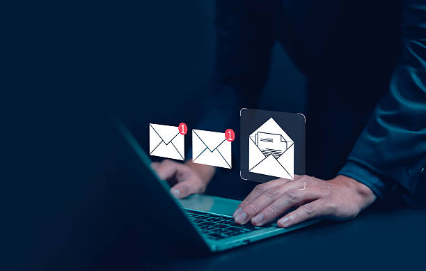 istock Businessman using laptop with new email notification icons, concept of digital communication, online message, and email marketing. Modern technology for business connection and information exchange. 2244908935