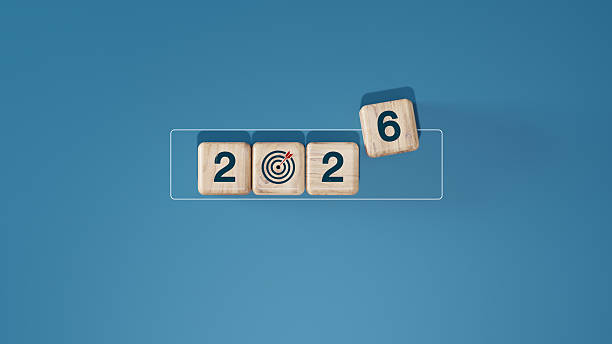 istock Wooden cubes forming year 2025 turning into 2026 with target icon and Loading... text. Concept of New Year goals, planning, transition, and business success. 2244909147
