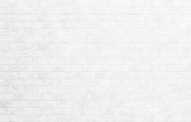 istock White brick wall background photo. Vintage white wash painted brick wall texture for stone tile block painted in grey light color wallpaper modern interior and exterior and backdrop design textured. 2244911367