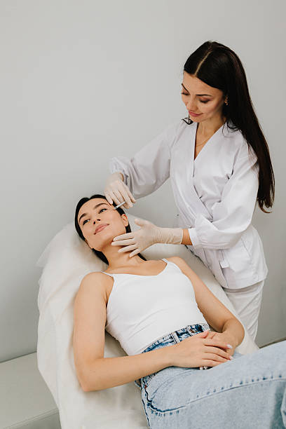 istock Full Face Botulinum Toxin Injection. Botulinum toxin therapy refines cheek contour. Aesthetic botulinum toxin full-face injection targets dynamic wrinkles for smooth and refreshed appearance. 2244914105