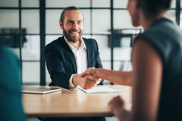 istock Successful business agreement sealed with a handshake in modern office 2244914345