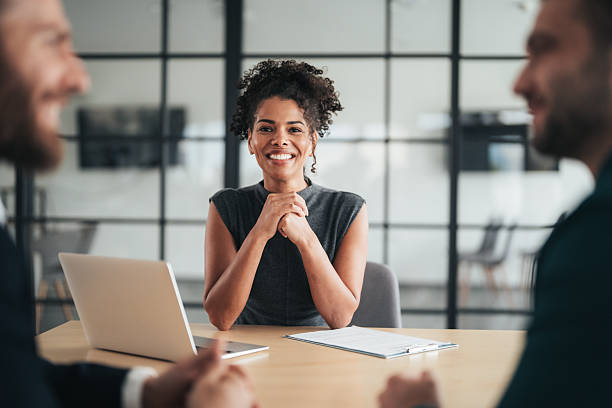 istock Insurance agents consulting clients in modern office 2244914353