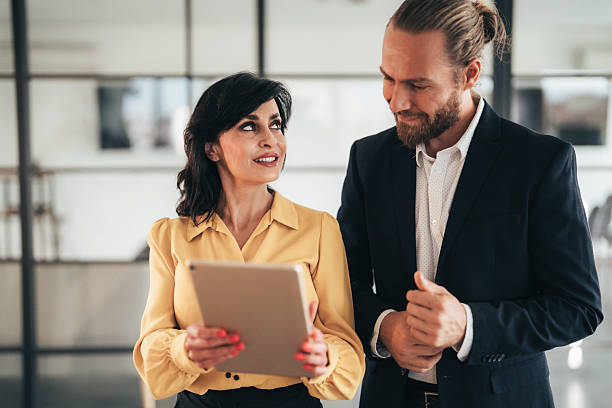 istock Confident business professionals talking on the go 2244914375