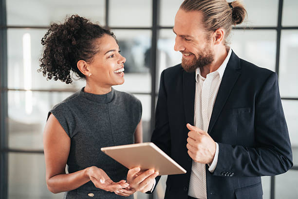 istock Confident business professionals talking on the go 2244914377