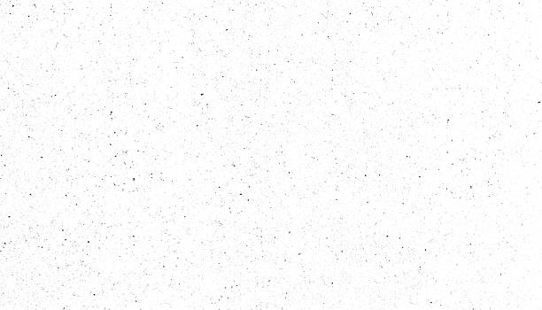 istock White grunge texture with scattered black speckles, ideal for backgrounds or overlays in design projects 2244915554