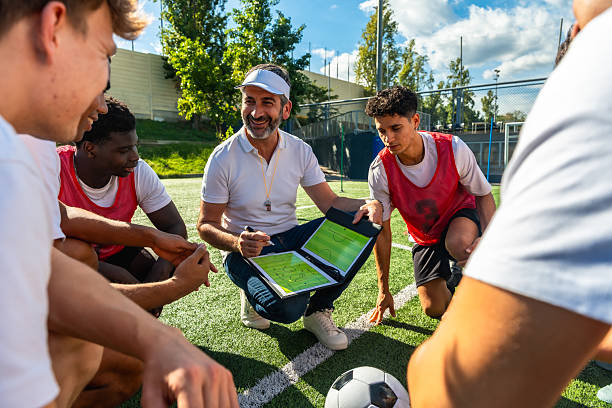 istock Soccer coach explaining strategy to young male team 2244916589