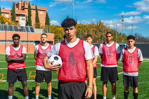 istock Young men soccer team training on green field 2244916618