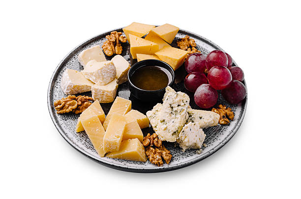 istock Cheese and fruit platter with nuts arranged on a decorative plate 2244918830