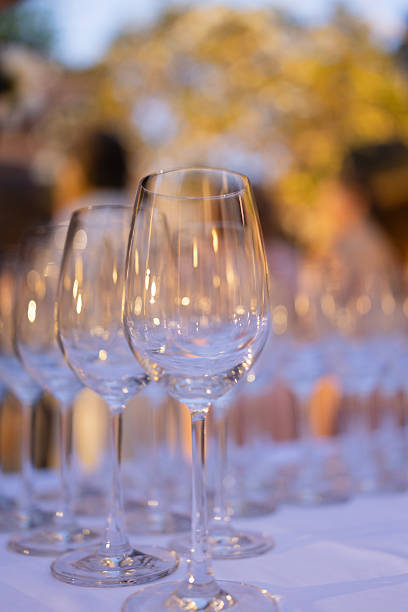 istock Red and white wine glasses on a beautifully set table. 2244919249