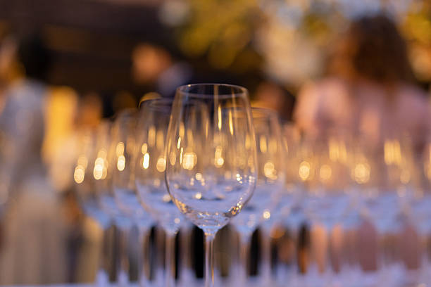 istock Red and white wine glasses on a beautifully set table. 2244919255