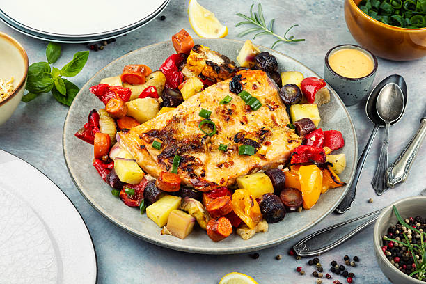 istock Fried salmon steak with potatoes and vegetables. 2244919455
