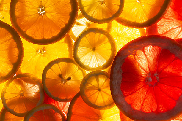 This vibrant image of citrus slices, including oranges and grapefruit, is arranged to create an eye-catching and refreshing visual, perfect for culinary or health-related themes emphasizing freshness and zest.