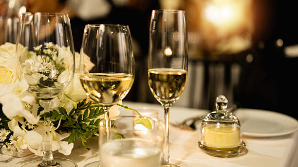 istock Red and white wine glasses on a beautifully set table. 2244920521