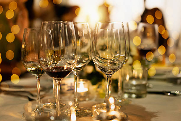 istock Red and white wine glasses on a beautifully set table. 2244920538