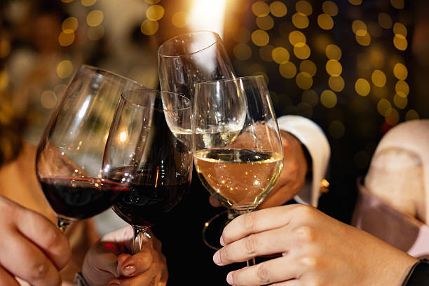 istock Red and white wine glasses on a beautifully set table. 2244920736