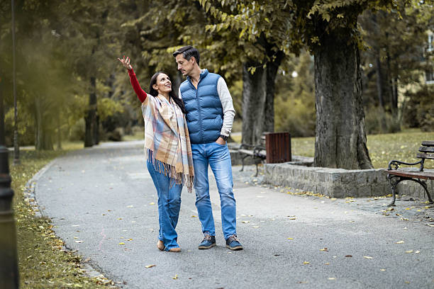 istock Couple Enjoying a Stroll in the Park 2244922364