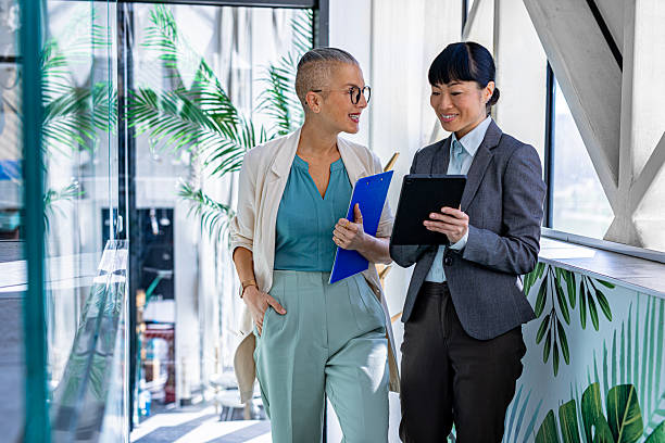 istock Successful businesswomen communicating on the go 2244923532