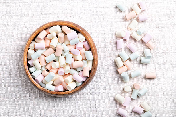 istock Multi-colored mini marshmallows, in a wooden bowl, on linen 2244923966