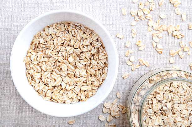 istock Rolled oats, thick-rolled and old-fashioned oats, in a white bowl, on linen 2244924003