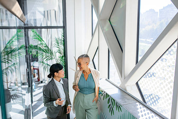 istock Successful businesswomen communicating on the go 2244924867