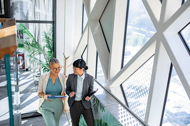 istock Successful businesswomen communicating on the go 2244924909