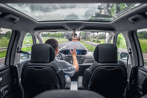 istock Driver gesturing while talking in car. Real travel moment. 2244924982